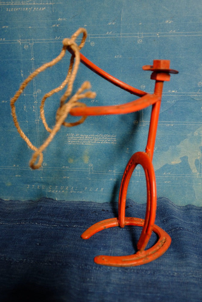 Vintage horseshoe cowboy folk art sculpture.