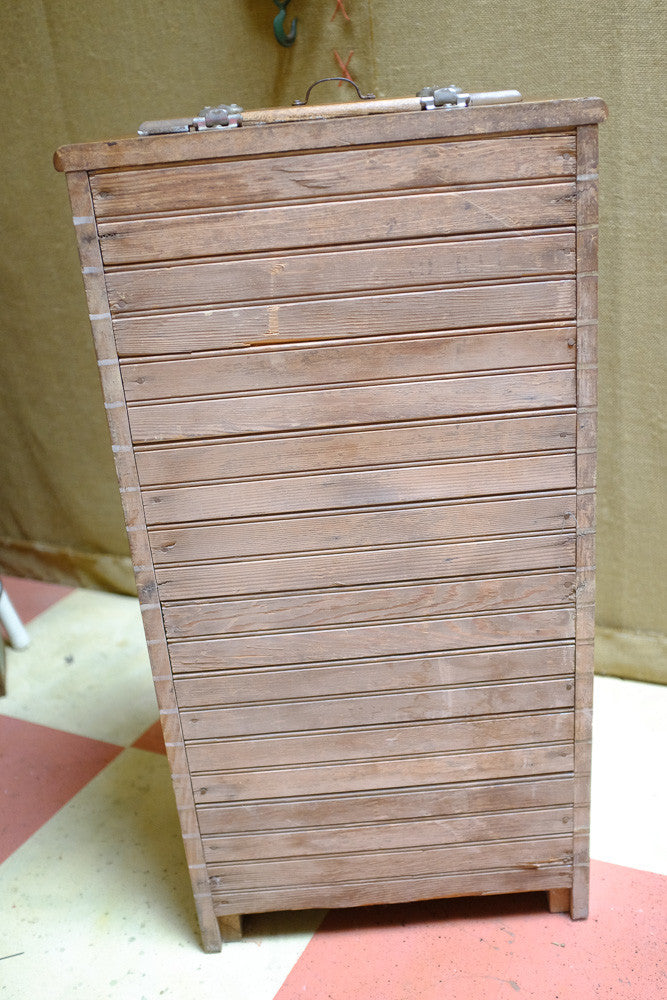 Vintage icebox cooler with antique oak wood design.