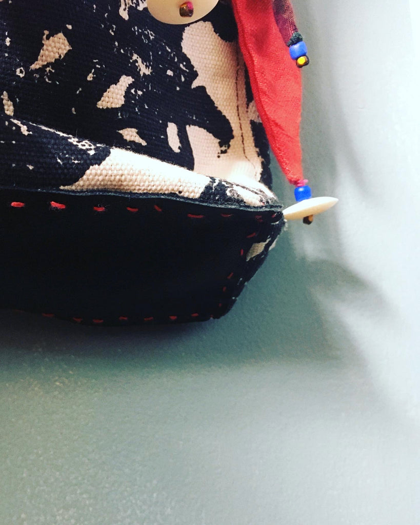 Ms. Hatter's harlequin bag