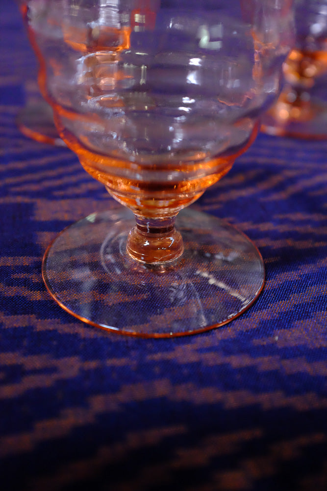 Pink Depression glass crystal stemware in tulip shape - Antares Furnishings