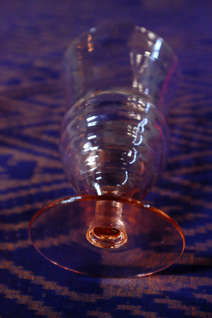 Vintage pink depression glass stemware showing ripples