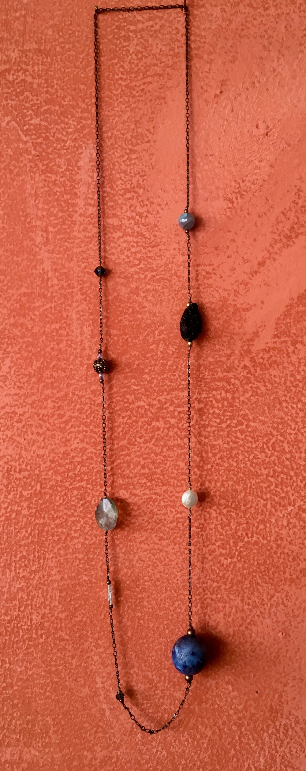 Handmade earth bead necklace on a copper chain with natural stones.