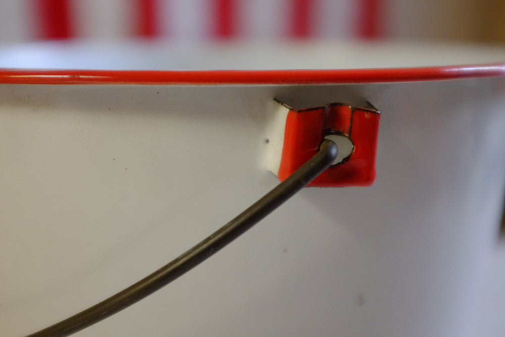 Vintage red and white enamel pail with wooden handle 