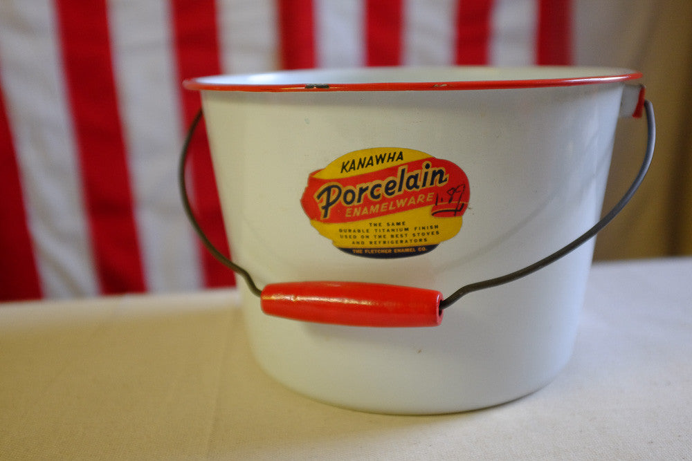 Vintage red and white enamel pail with wooden handle 