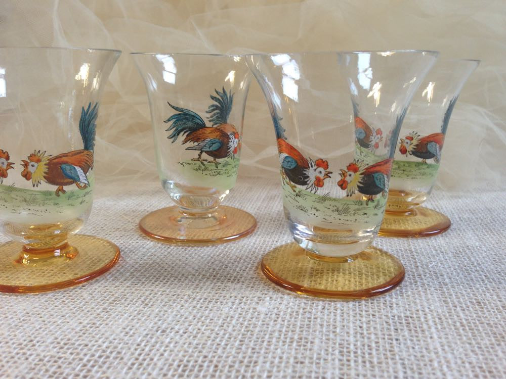 Vintage French rooster crystal glassware on a lace tablecloth