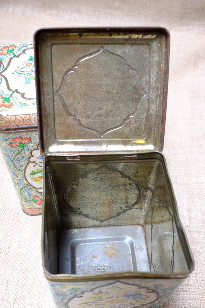Vintage tea tins with floral patterns