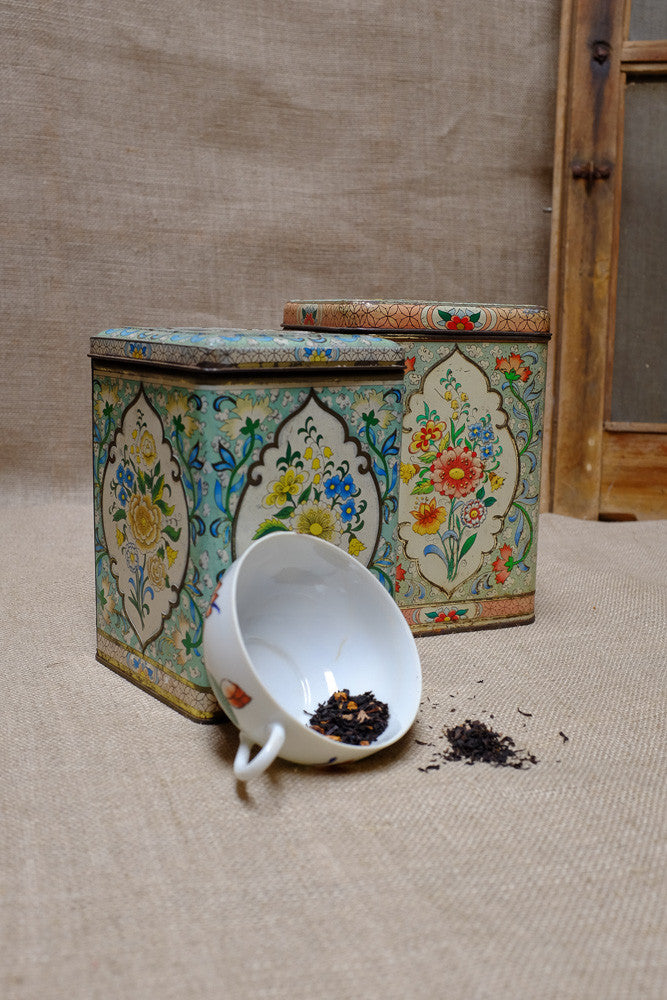 Vintage tea tins with floral patterns