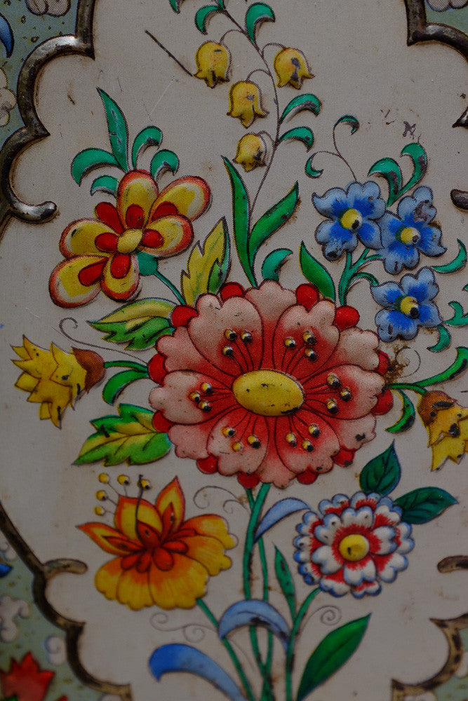 Vintage tea tins with floral patterns