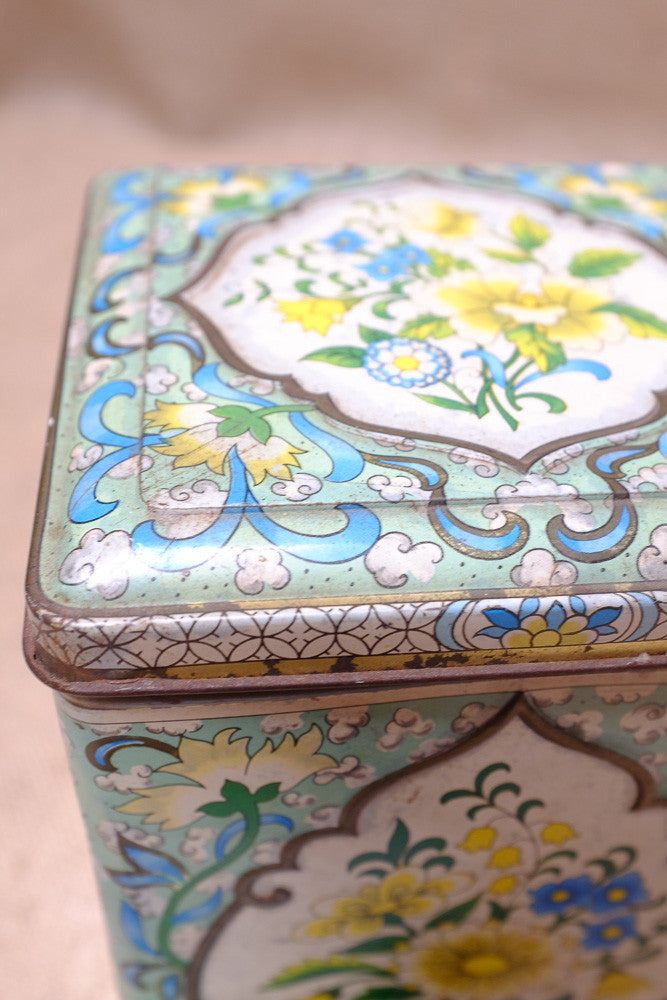 Vintage tea tins with floral patterns