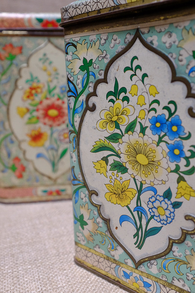 Vintage tea tins with floral patterns
