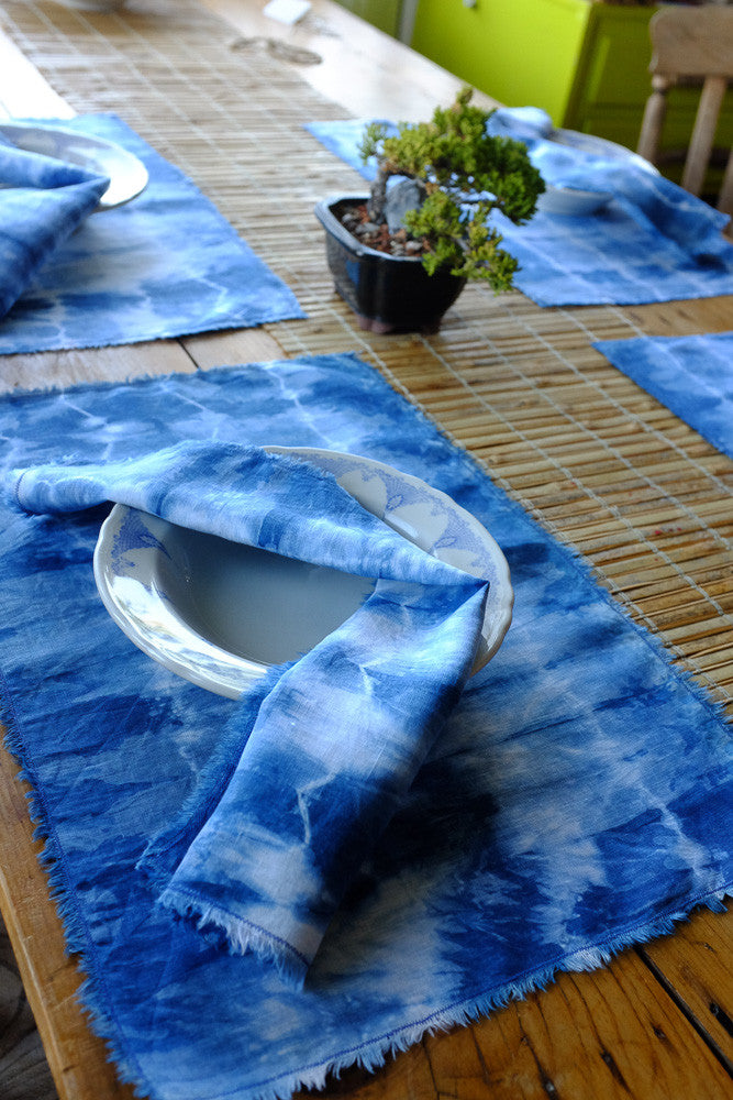 Handmade indigo tie-dyed linen placemats.