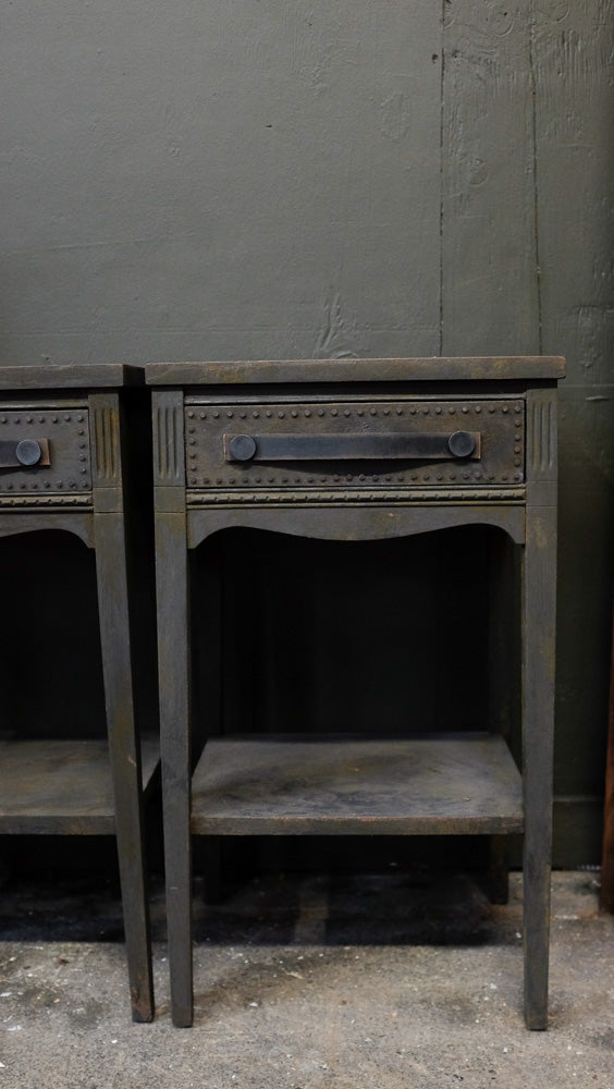 Charcoal side tables with provincial style and distressed leather handles.