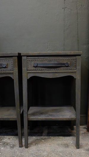 Charcoal side tables with provincial style and distressed leather handles.