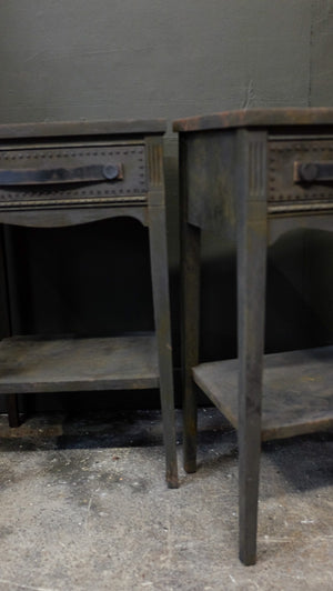 Charcoal side tables with provincial style and distressed leather handles.