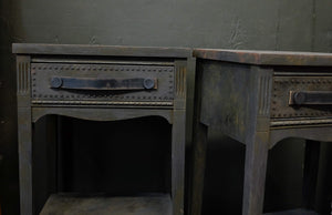 Charcoal side tables with provincial style and distressed leather handles.
