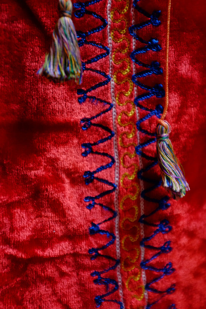 Vintage velvet folk dress with 1950s antique clothing design.