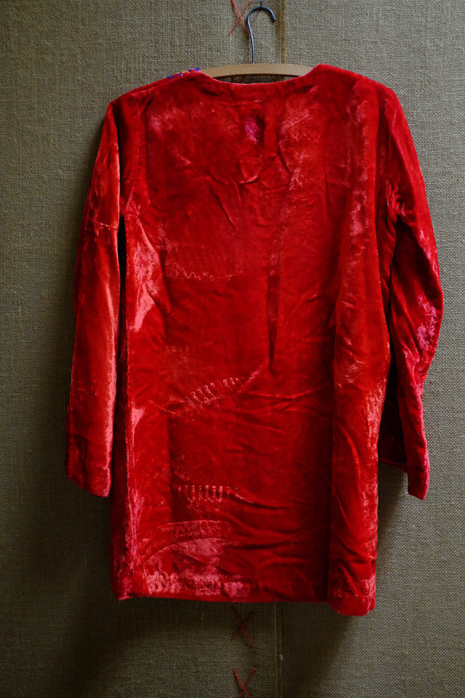 Vintage velvet folk dress with 1950s antique clothing design.