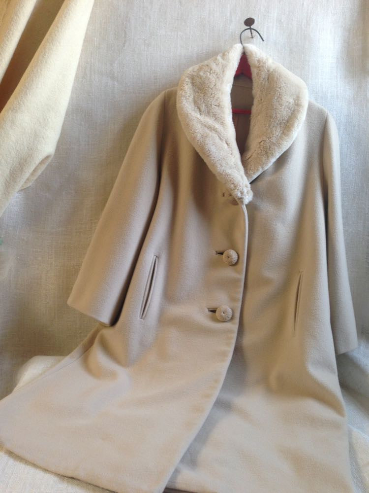 Vintage fur-collar coat with mid century winter fashion design.