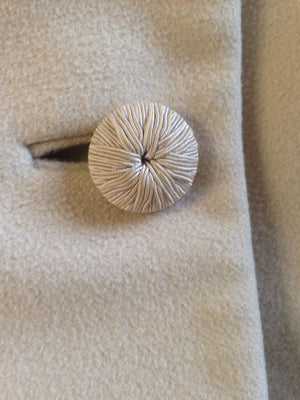 Vintage fur-collar coat with mid century winter fashion design.