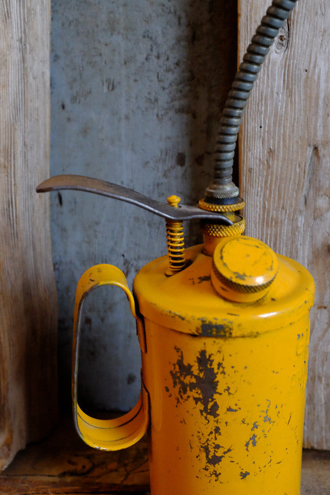 vintage yellow oil can - Antares Furnishings